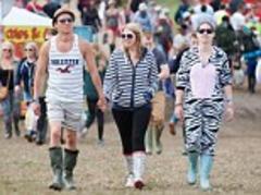 Wellies on for start of Isle of Wight Festival as weekend rain threatens to turn it in to Glastonbury-style mudbath